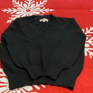 Woman’s black sweater